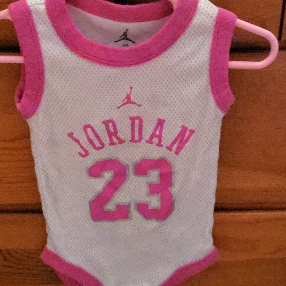 Pink and white Jordan jersey onesie